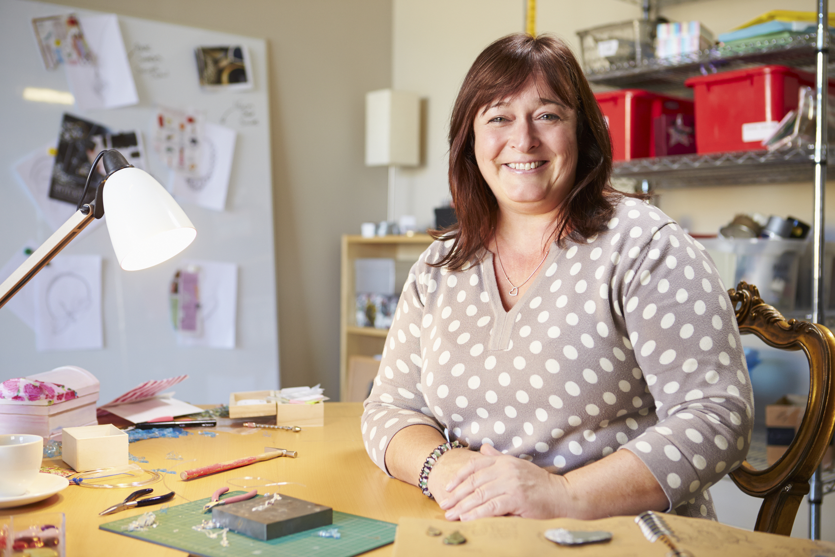 Portrait Of Mature Woman Making Jewelry At Home